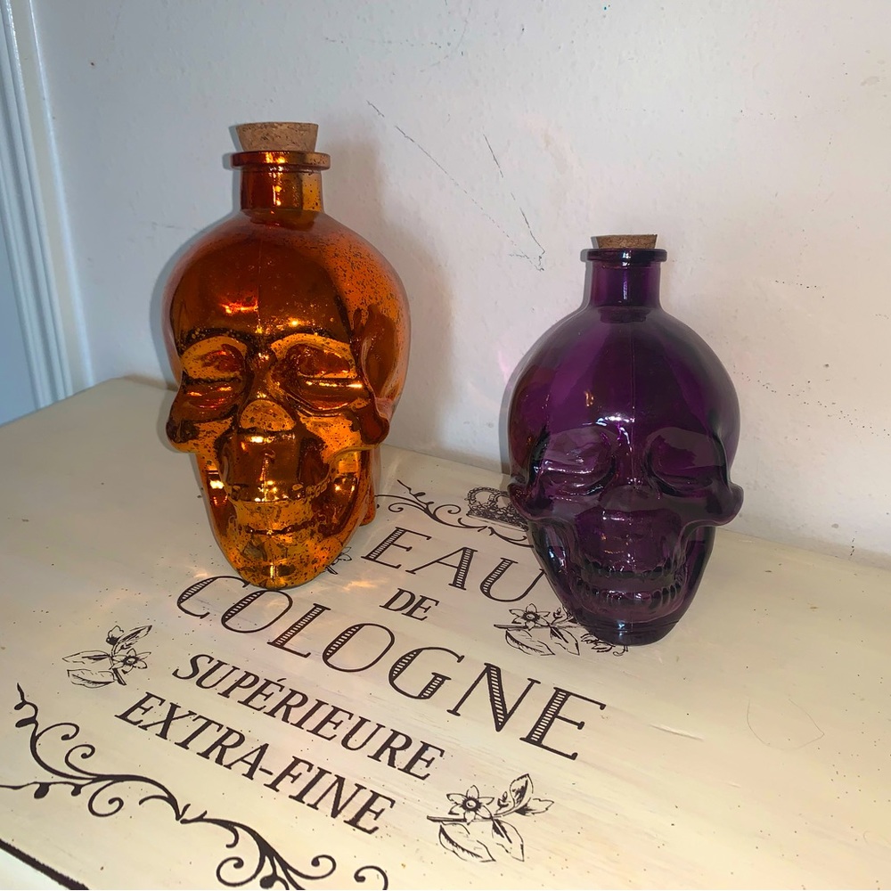 Orange and purple glass skeleton head jars